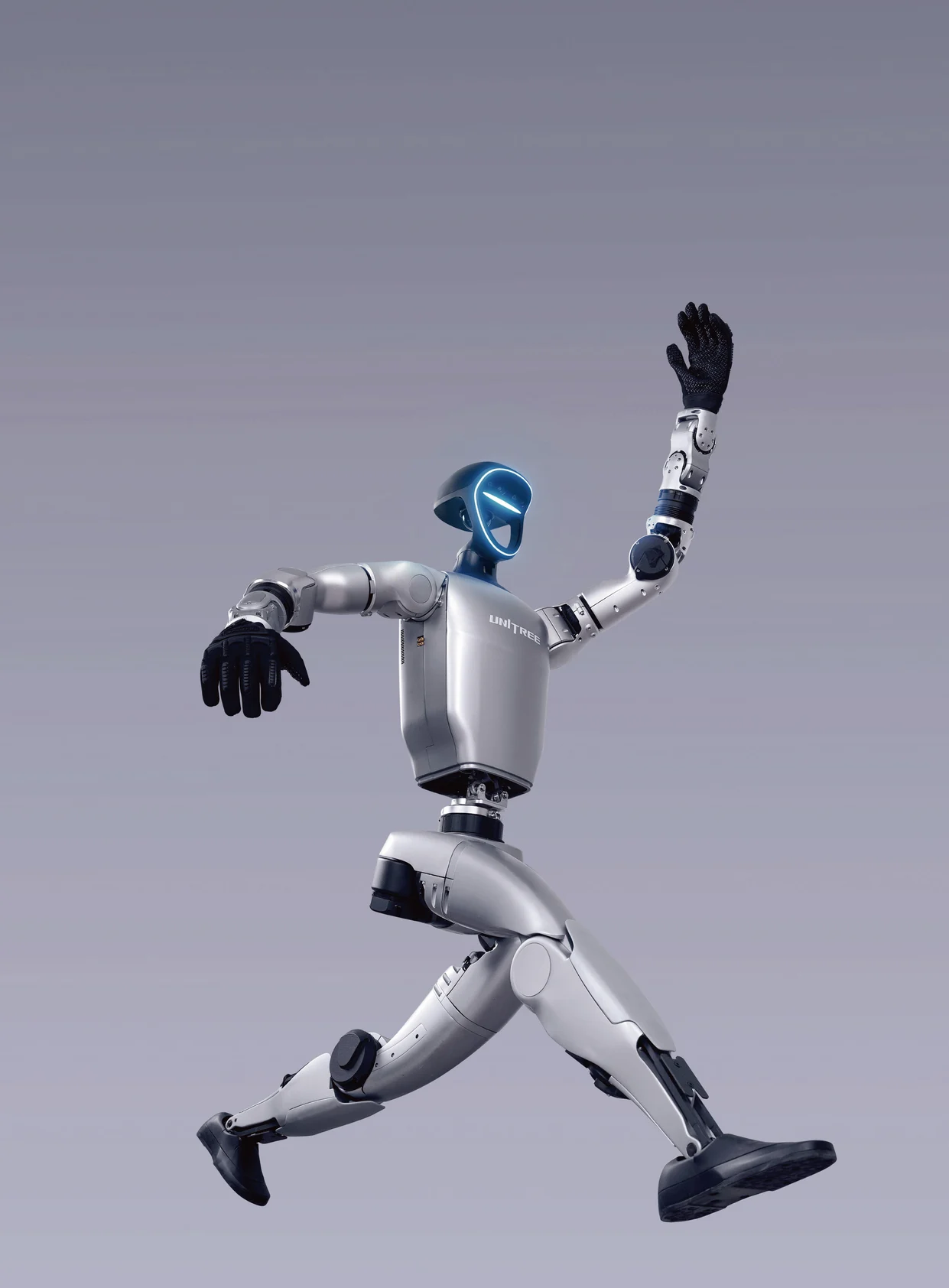Unitree G1 humanoid robot with one arm raised in a dynamic running pose