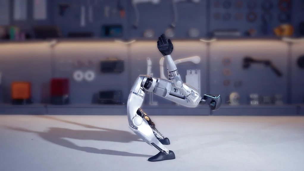 Unitree G1 demonstrating balance on one leg in a robotics lab