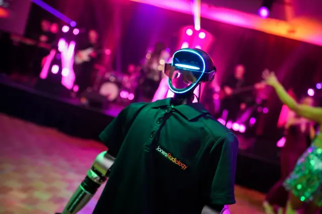 Rocco humanoid robot on a colourful corporate event dance floor