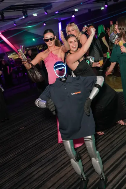 Humanoid robot dancing with guests at a corporate event