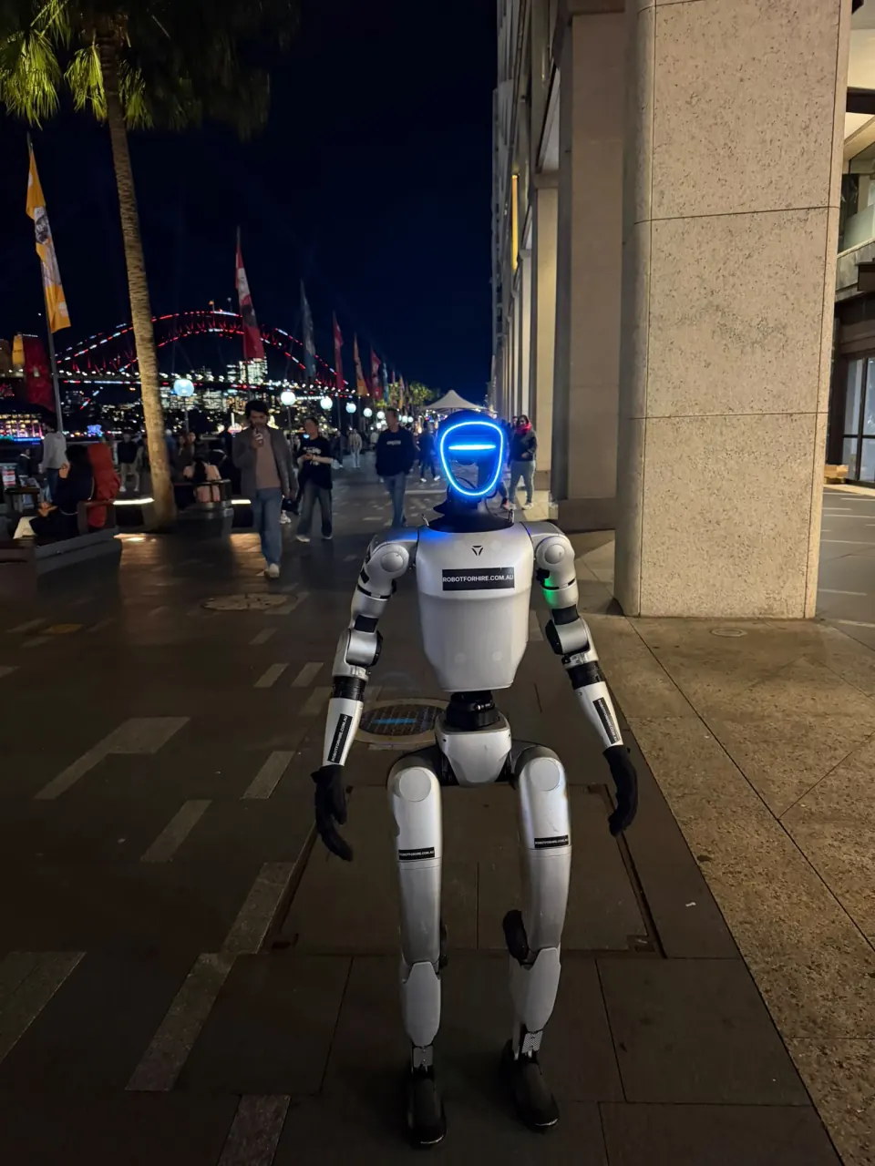 Rocco humanoid robot at Circular Quay with Sydney Harbour Bridge behind