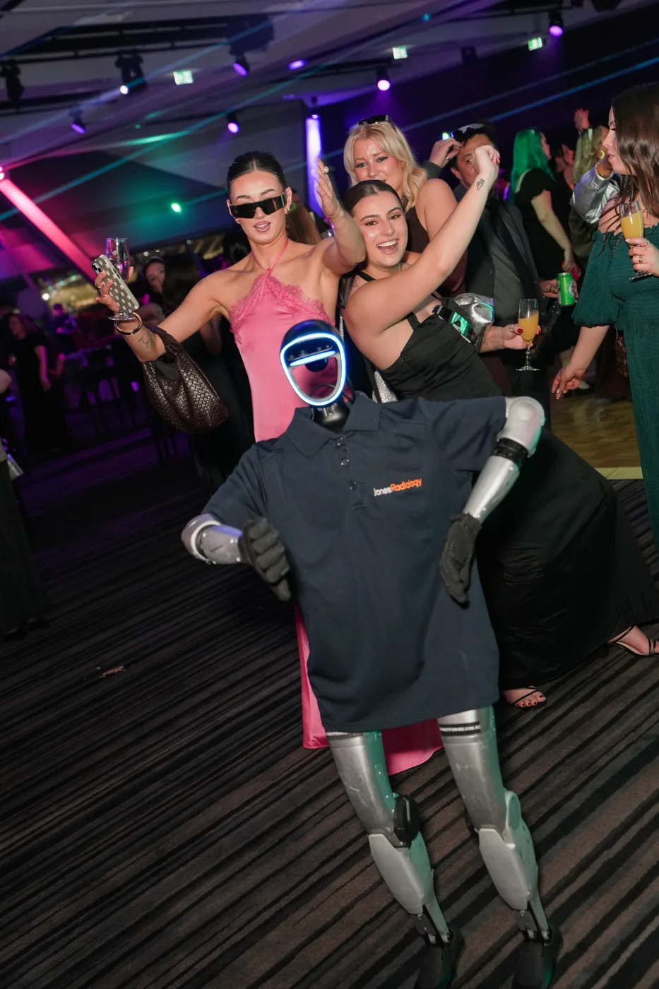 Jones Radiology staff dancing behind Rocco on the ballroom dance floor