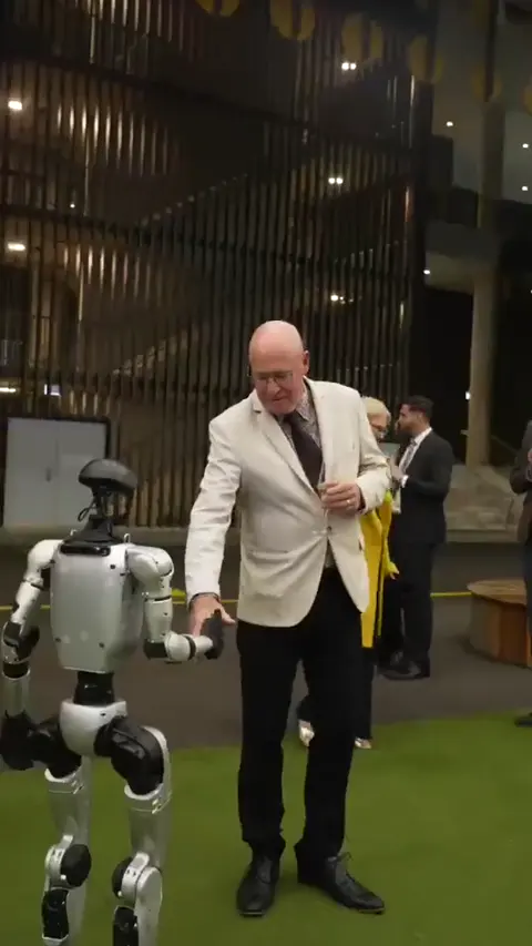 Rocco humanoid robot interacting with a guest at an event