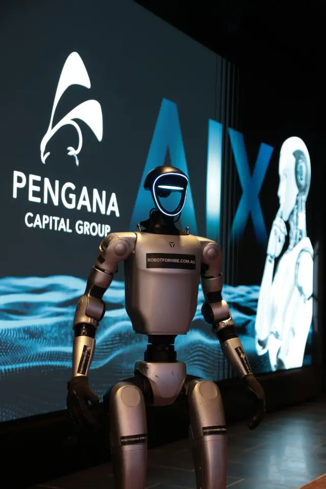 Rocco humanoid robot in front of Pengana Capital Group AIX branding